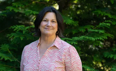 Portrait of Jennifer Morton against trees